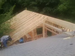 Framing a new roof addition that ties into an existing shingle roof in Livermore Falls